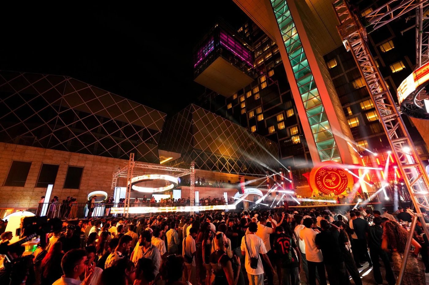Night concert with stage lighting and a large crowd
